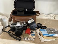 Canon AE-1 35mm SLR Film Camera with 50mm f/1.8 Lens, speed light, strap and bag