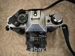 Canon AE-1 35mm SLR Film Camera with 50mm f/1.8 Lens, speed light, strap and bag