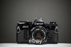 Canon AE-1 Black 35mm Film Camera with Canon 50mm f/1.8 Lens SLR Tested