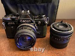 Canon AE-1 Black 35mm Film SLR Camera f128 28mm Phase 2 Auto Lens + Xtra L