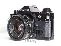 Canon AE-1 Program 35mm SLR Film Camera With 50mm FD Film Black TESTED