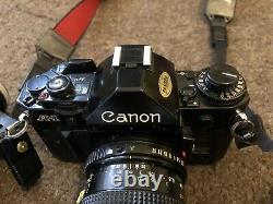 Canon A-1 35mm SLR Film Camera Black With 3 Lens Kit Filters And Carry Case