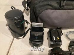 Canon A-1 35mm SLR Film Camera Black with 2X Lens, Bag, Flash & Accessories