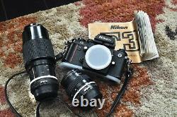 Nikon F3 camera body with two Nikon Nikkor lenses new batteries