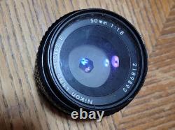 Nikon FE Silver 35mm Film Camera Body with Lenses And Flash Attachment
