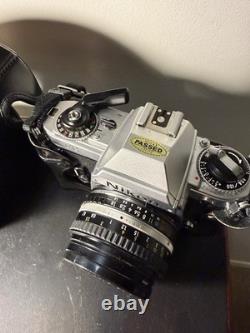 Nikon FG 35mm SLR Film Camera with Series E 50mm f/1.8 Lens Leather Case Manuals