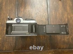 Nikon FM2 Silver 35mm SLR Film Camera with 35-105mm 13.54.3 Tokina Lens TESTED