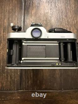 Nikon FM2 Silver 35mm SLR Film Camera with 35-105mm 13.54.3 Tokina Lens TESTED