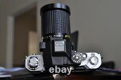 Nikon F 2 camera body with a lens and new batteries