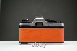 Olympus OM10 35mm Film Camera with 50mm f/1.8 Zuiko Lens Orange Leather Serviced