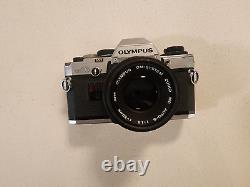 Olympus OM-10 35mm SLR Film Camera with 50 mm lens Kit