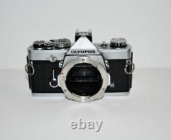 Olympus OM-1 film camera and 28mm lens, film tested, very good condition