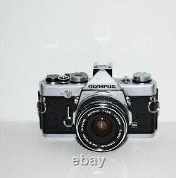 Olympus OM-1 film camera and 28mm lens, film tested, very good condition