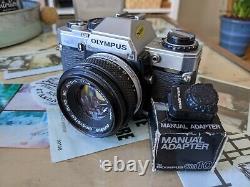 Olympus om10 35mm SLR Film Camera with 50mm 1.8 Zuiko Lens and Manual Adapter